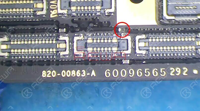 For better inspection, tear off sponge around connectors first. Then we should check the motherboard under the microscope. We can find that one component next to the power flex cable has fallen off the board. 