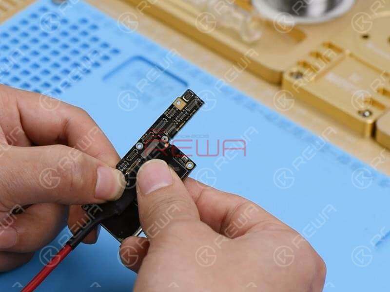 Touch the motherboard with one hand. The NAND flash chip and the area surrounding it are hot. Which indicates that rails on the area might have shorted. Since there are so many components on the hot area, we can locate the faulty component with the help of the Thermal Imager.